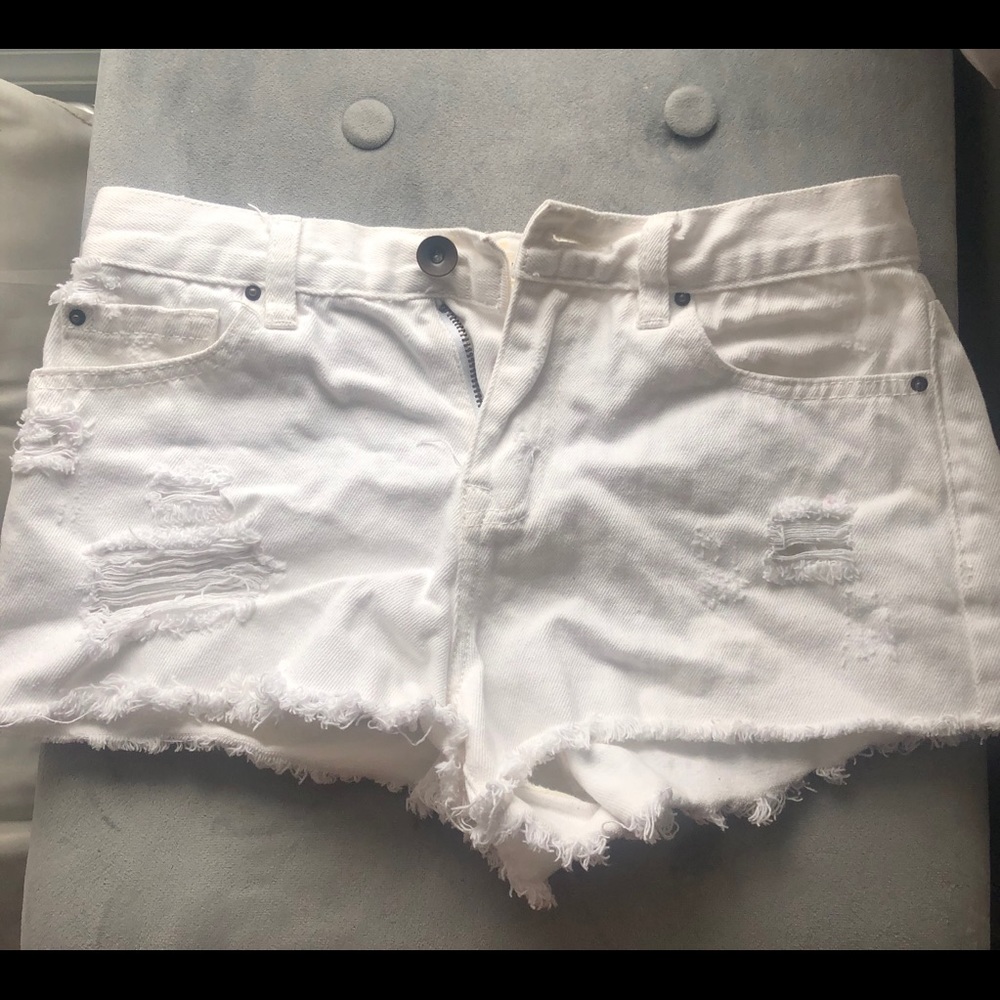 White ripped shorts